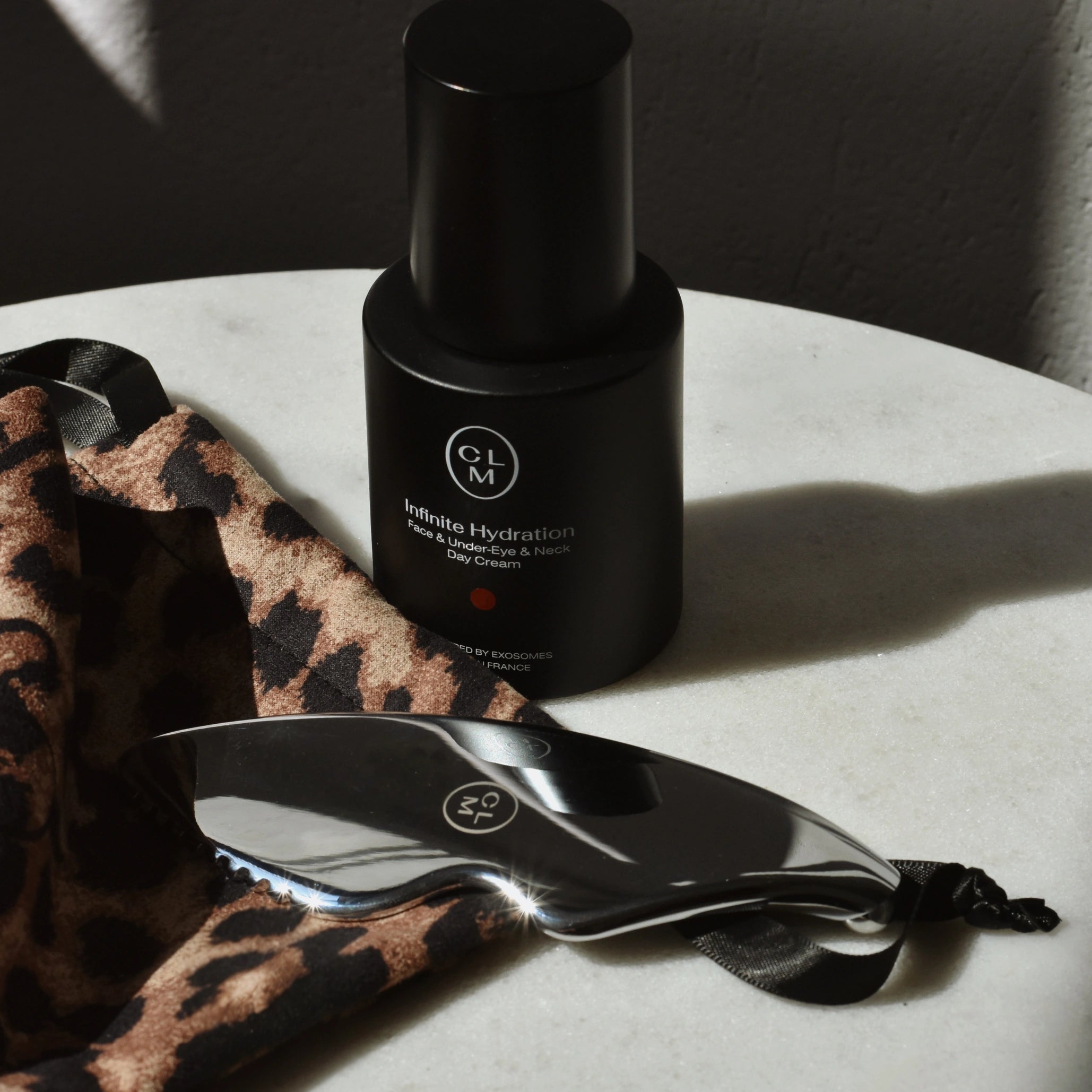 CLM Infinity Hydration Face, Eye, and Neck Cream, Gua Sha, and Pouch Set